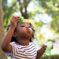 african-kid-playing-with-bubbles-2021-11-03-20-32-31-utc-e1659807514401.jpg