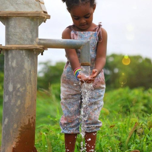 girl-washing-her-hands-at-a-water-well-in-burkina-faso-africa-e1659542851666.jpg